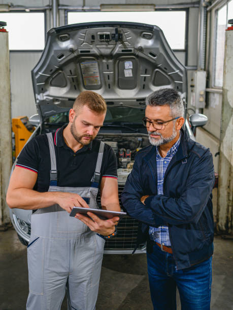 auto mechanic with customer